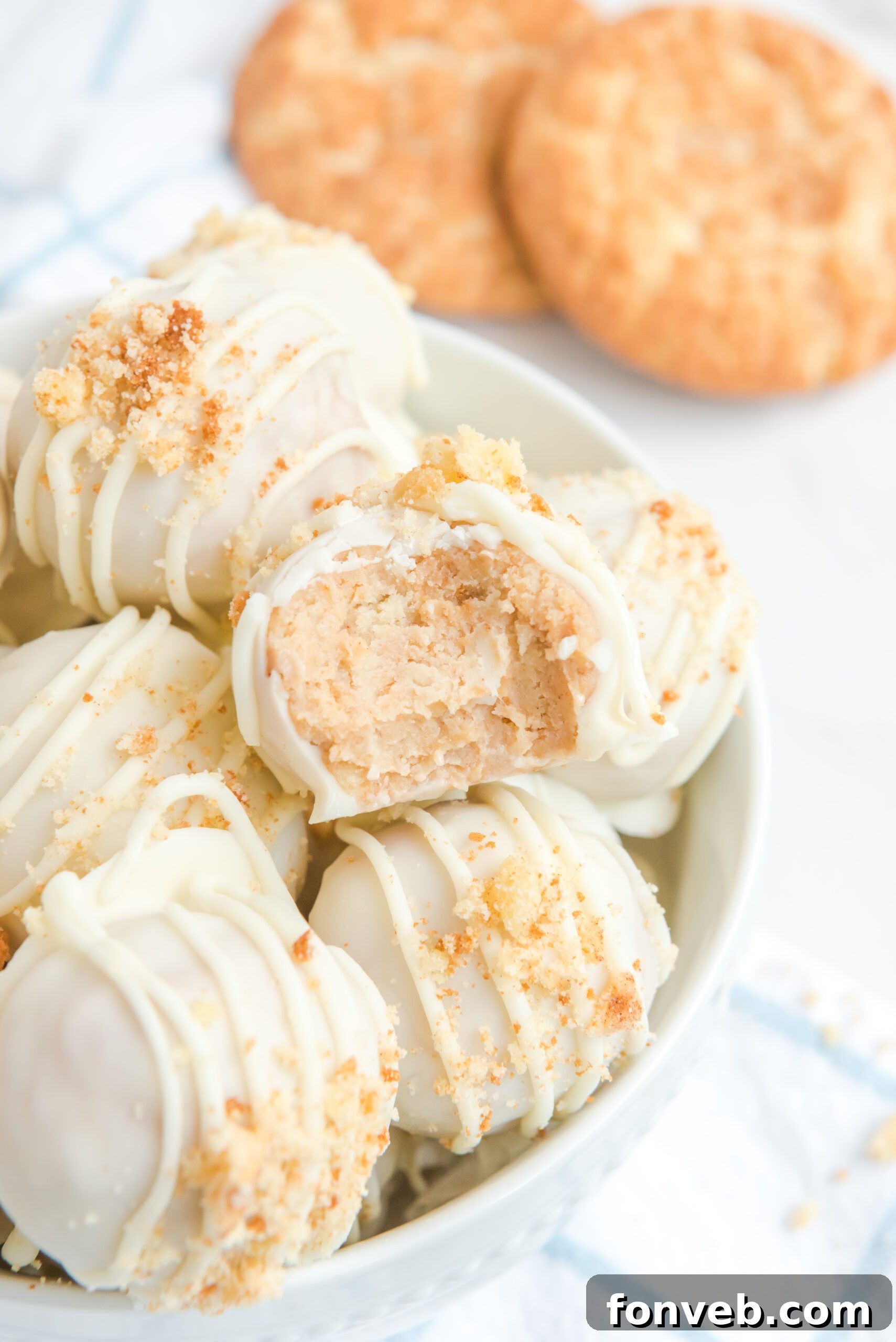Close up of the crushed snickerdoodle topping on the truffles. One with a bite missing