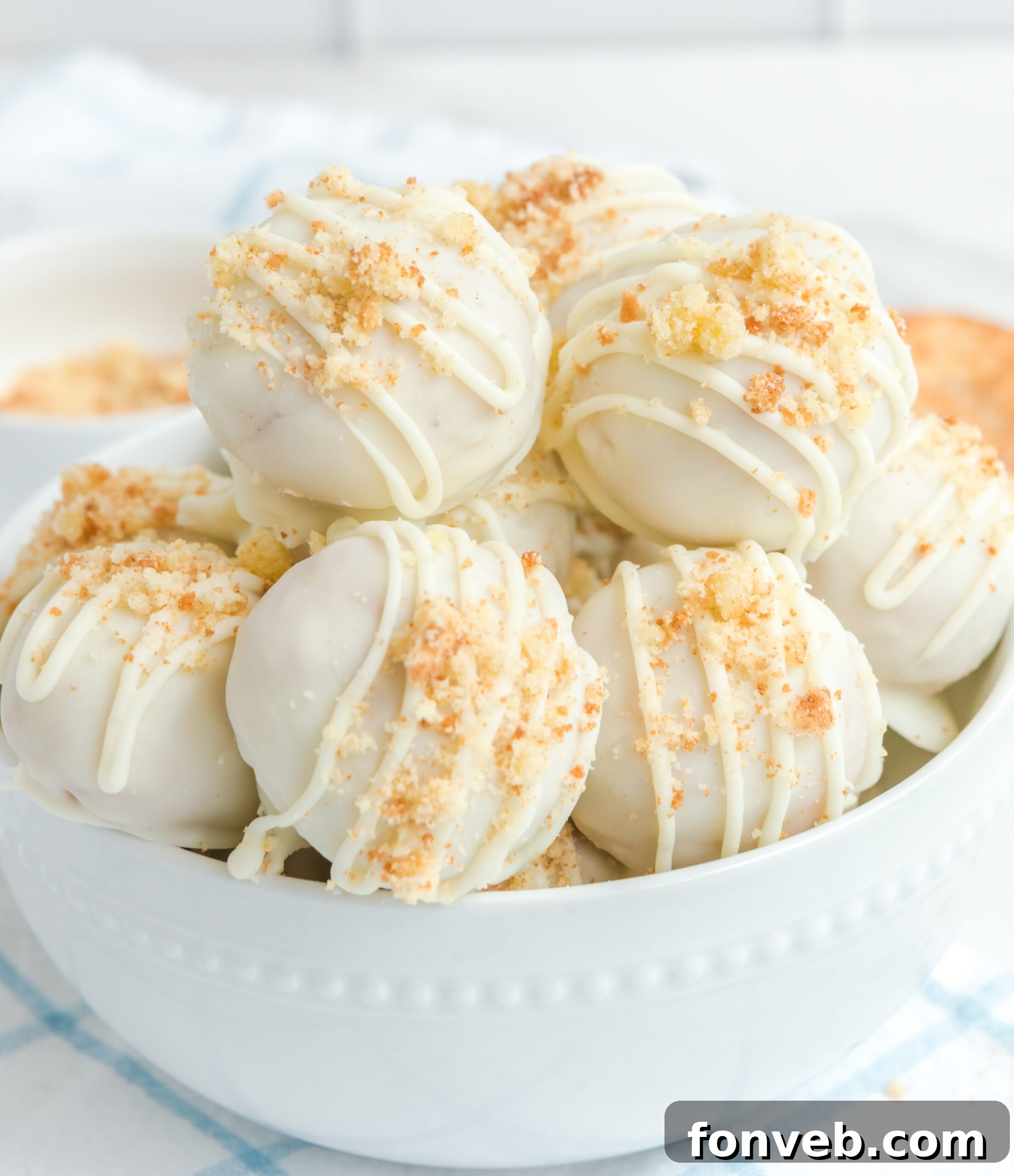 A snickerdoodle truffle stacked on top of other truffles 