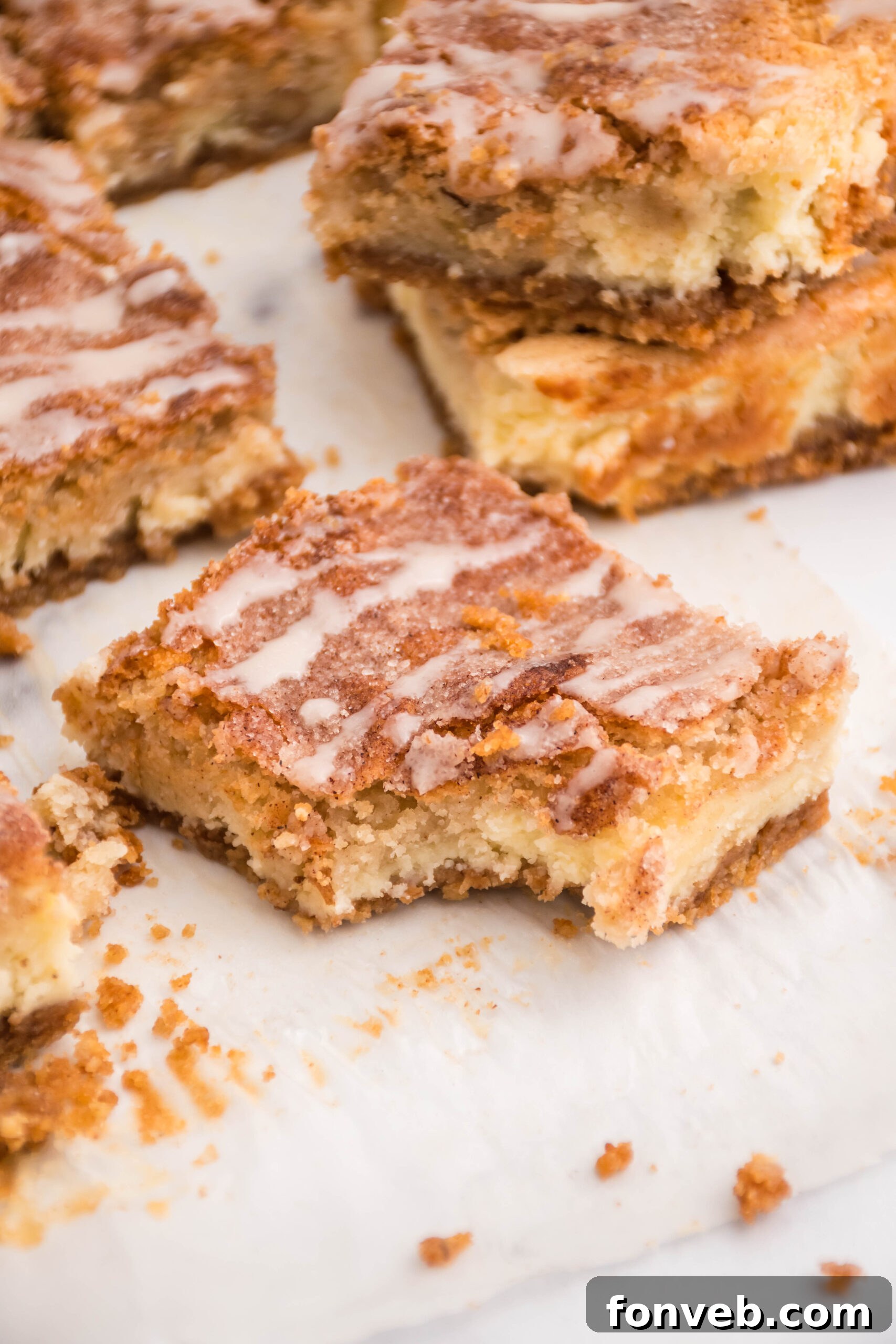 Up close view of a bite removed from a cheesecake bar.