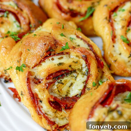Swirled Pizza Bites 17 Delicious Pizza Pinwheels, perfect for parties or snacks.