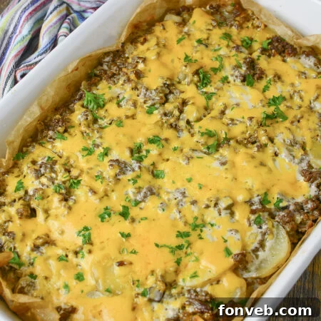 Golden Cheesy Beef and Potato Bake 16 A perfectly baked Ground Beef and Potato Casserole in a circular dish, ready to be served.