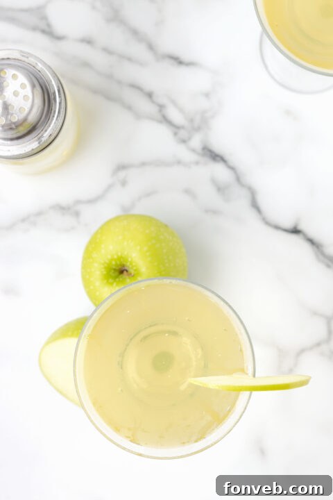 The finished Appletini with an apple slice garnish.