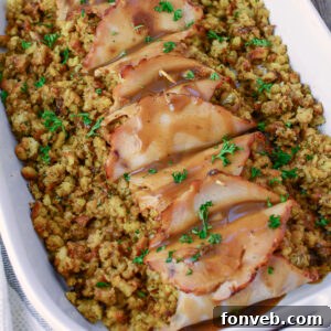 A finished Turkey Stuffing Roll on a white plate.