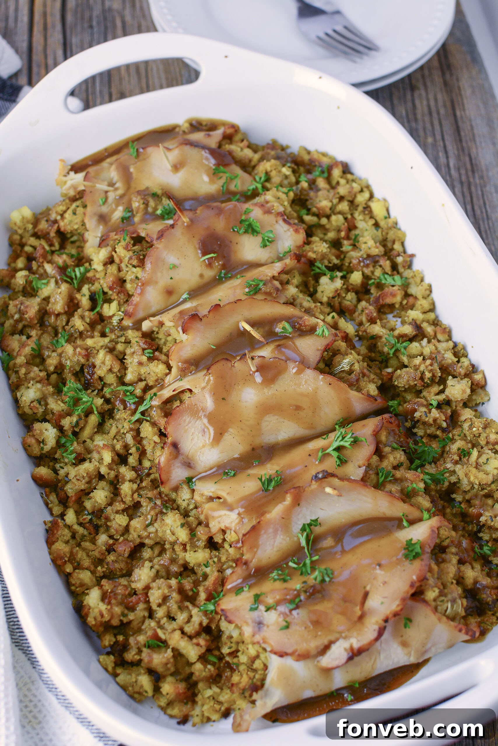 Turkey Stuffing Roll Ups on a white plate with mashed potatoes