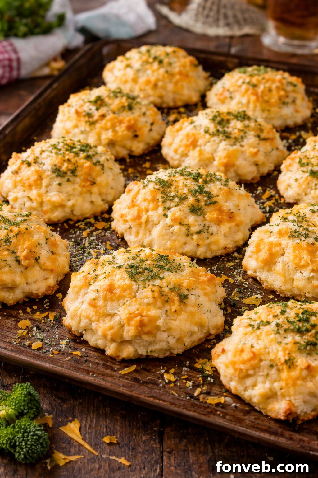 Copycat Red Lobster Cheddar Bay Biscuits on a baking sheet, golden brown and fresh out of the oven