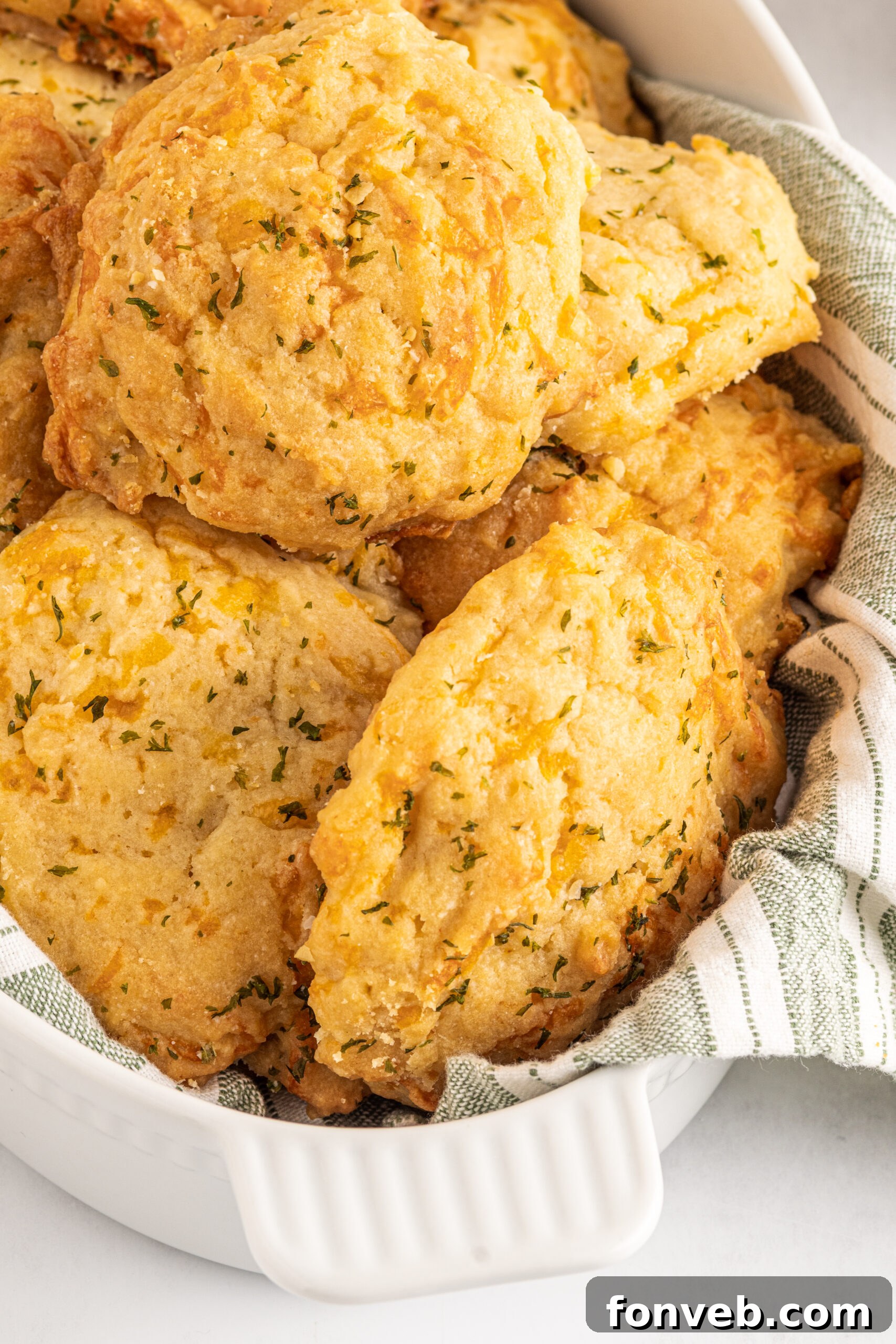 Copycat Red Lobster Cheddar Bay Biscuits in a rustic woven basket, ready to be served