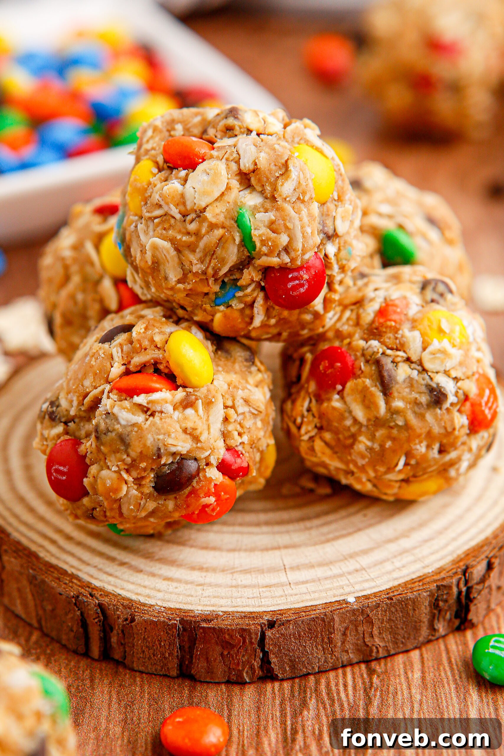 Close up view of No Bake M&M Energy balls on a wooden table
