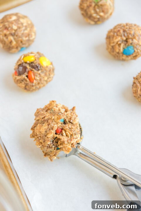 No Bake M&M Energy Balls chilling in the refrigerator.