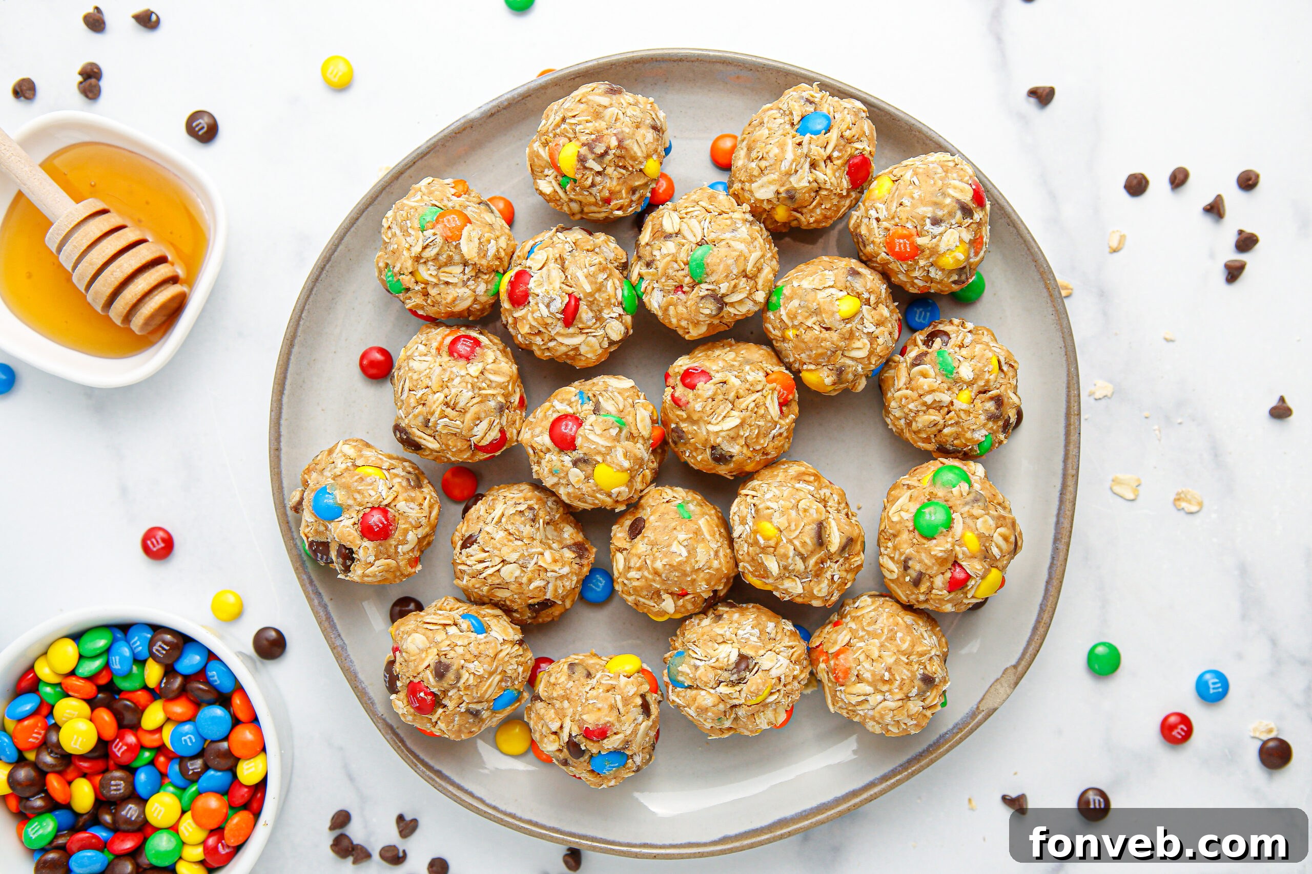 overhead view of No Bake M&M Energy balls on a large gray plate