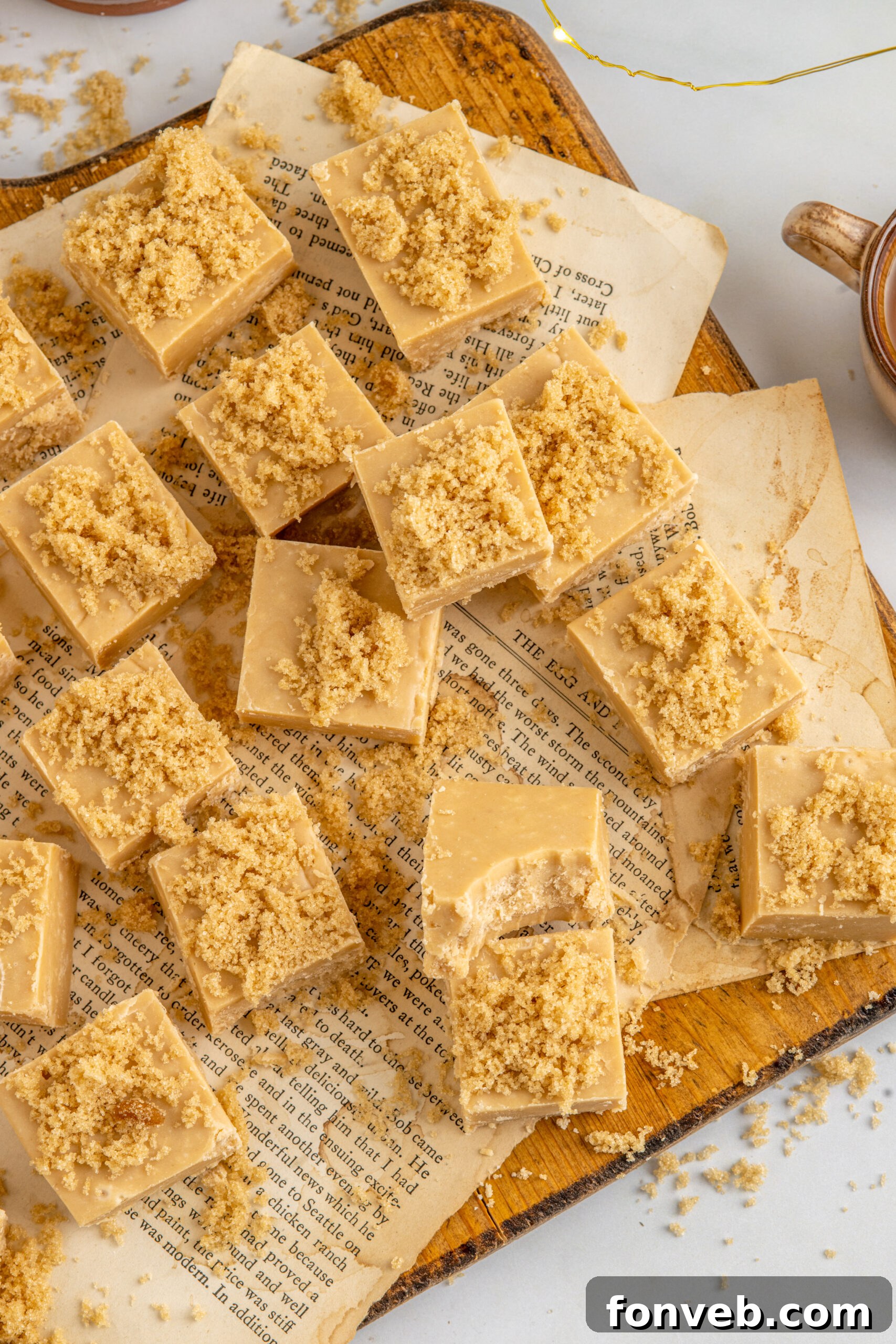 Overhead view of Penuche Fudge squares on a wooden board, beautifully presented.