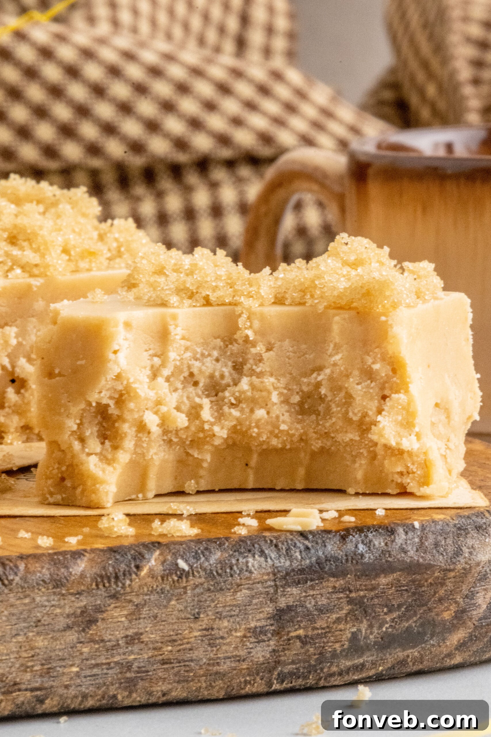 An up-close view of a Penuche Fudge piece, revealing its smooth, dense texture after a bite.