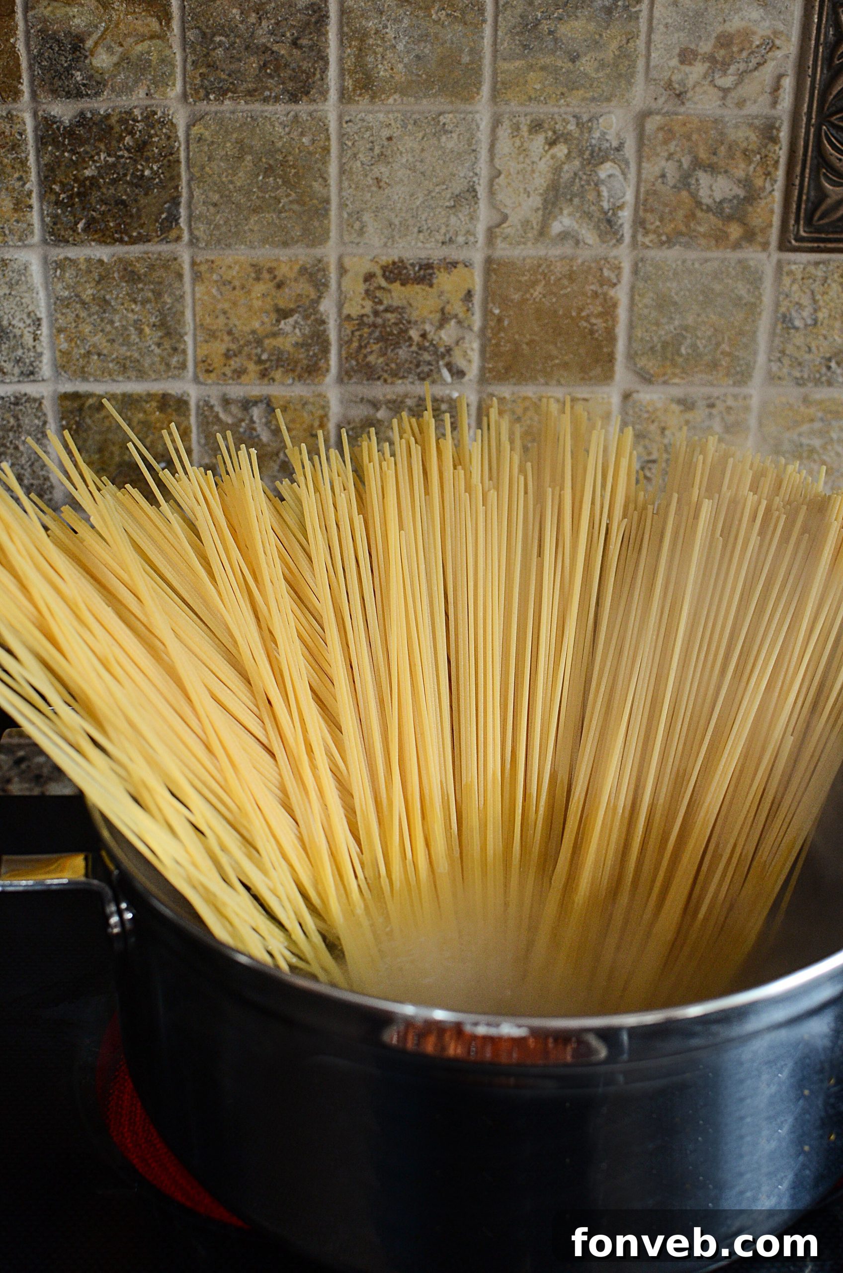 Creamy spaghetti mixture being prepared