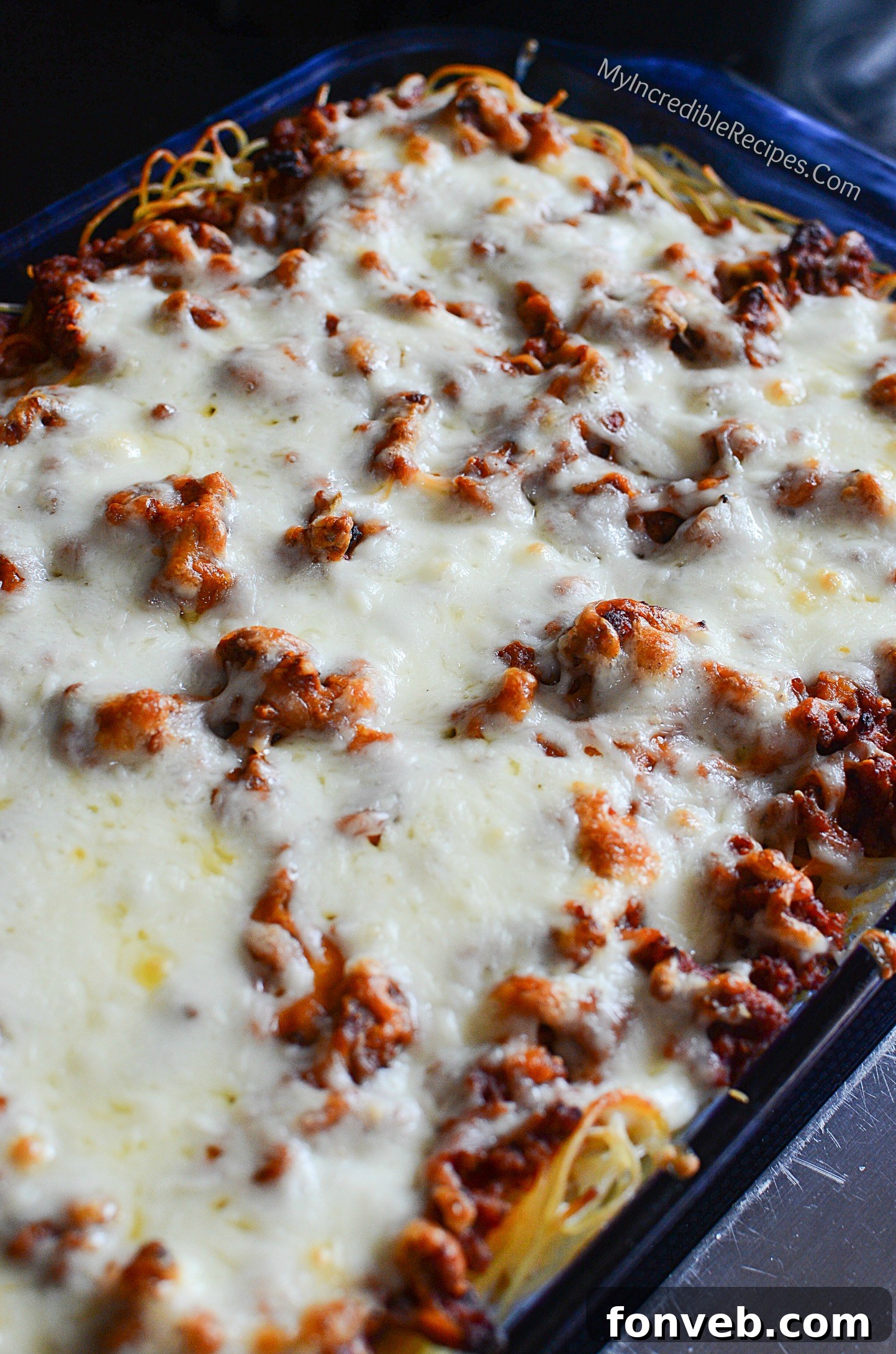 Baked Million Dollar Spaghetti with melted cheese topping