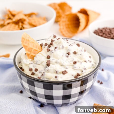 A side view of the delicious Cannoli Dip, beautifully presented in a black and white dish.