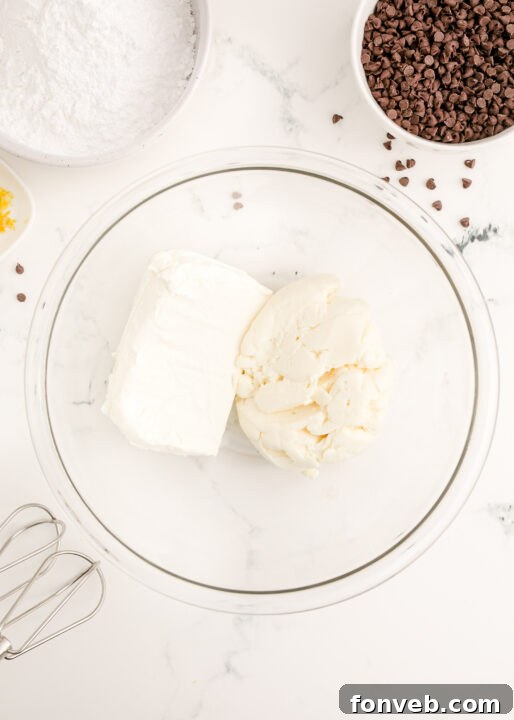 Ricotta cheese being spooned into a mixing bowl, ready for whipping.
