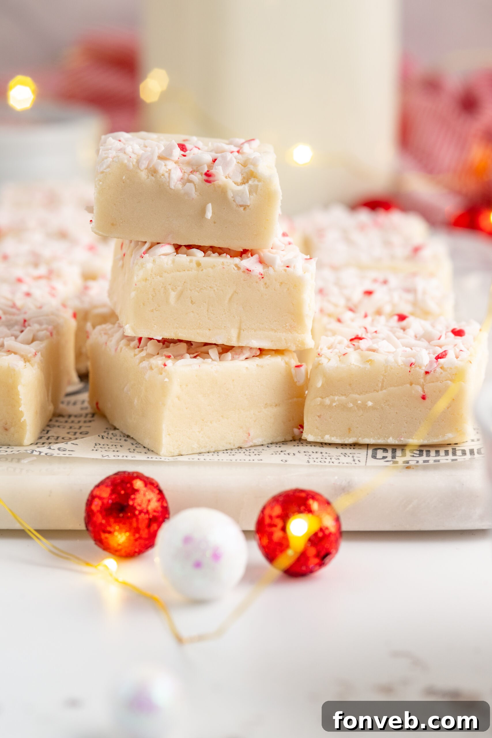 Three pieces of peppermint fudge stacked on top of each other.