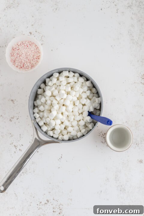 Close-up of a fudge mixture with white chocolate chips before melting.