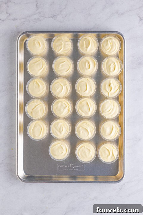 Mini Banana Split Delights 11 Finished Banana Split Shots, garnished with chocolate and sprinkles.