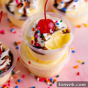 Finished Banana Split Shots, garnished with chocolate and sprinkles.