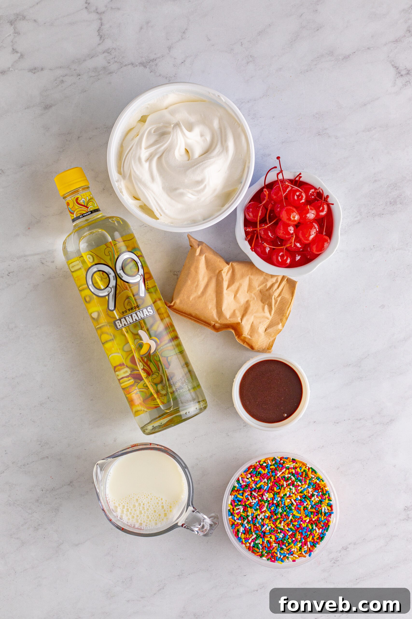 Mini Banana Split Delights 6 Overhead view of all the ingredients meticulously laid out for the Banana Split Shots recipe.