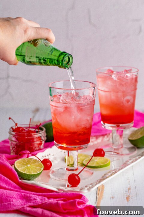 Artistic shot of a Dirty Shirley Temple with vibrant colors.