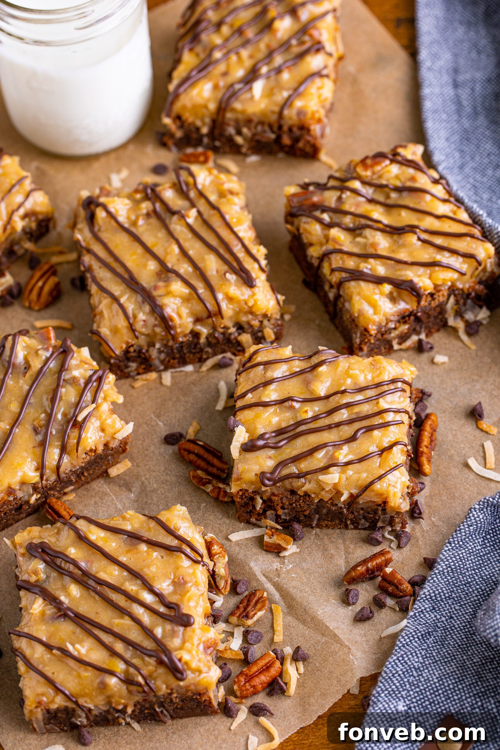 Overhead view of German Chocolate Brownies arranged neatly on a piece of parchment paper, highlighting their textured topping.