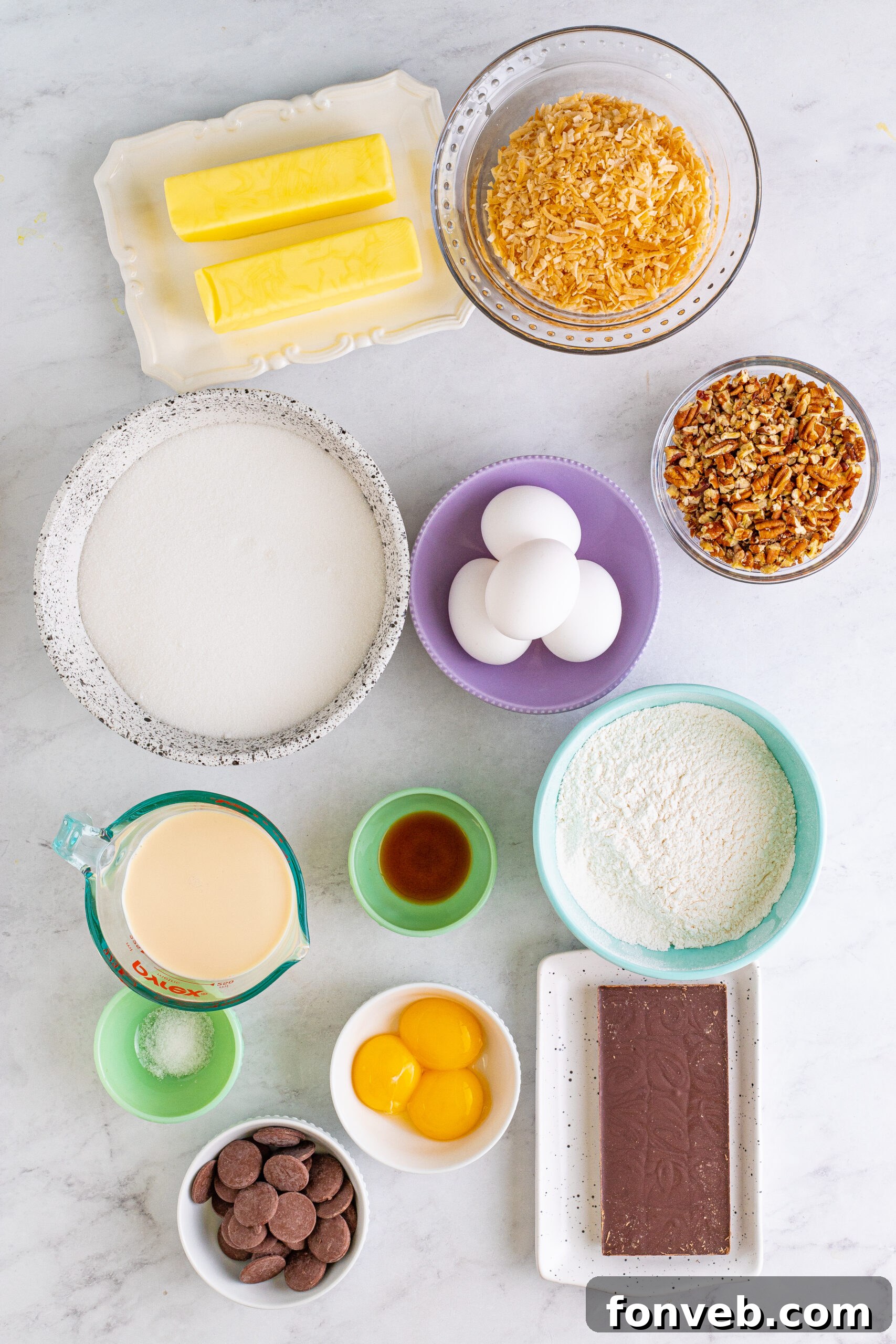 Overhead view of all the raw ingredients neatly laid out on a surface, ready to be used for the German Chocolate Brownies recipe.