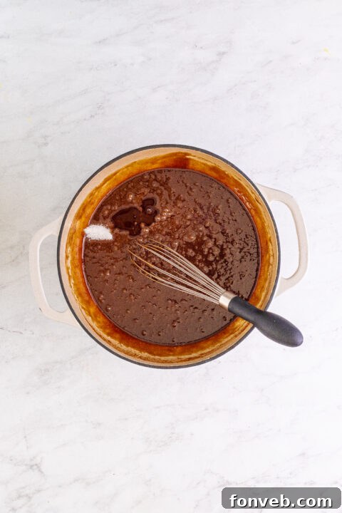 A sliced German Chocolate Brownie on a small plate.