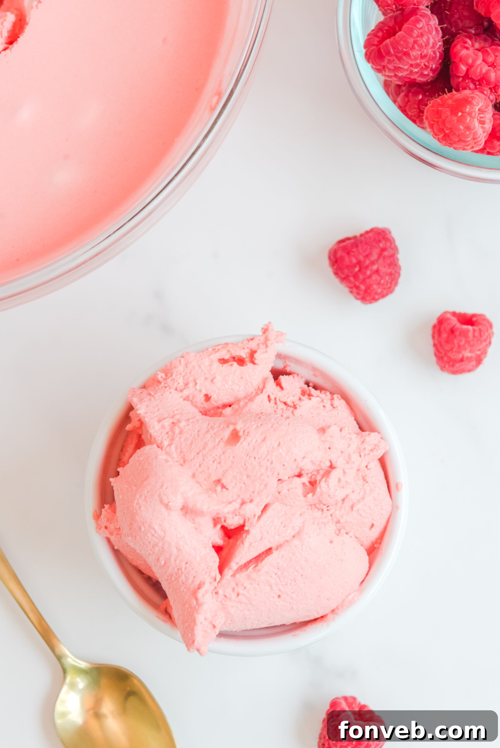 Luscious Raspberry Whip 3 Overhead view of Raspberry Jello Fluff in a white dish, ready to be served.
