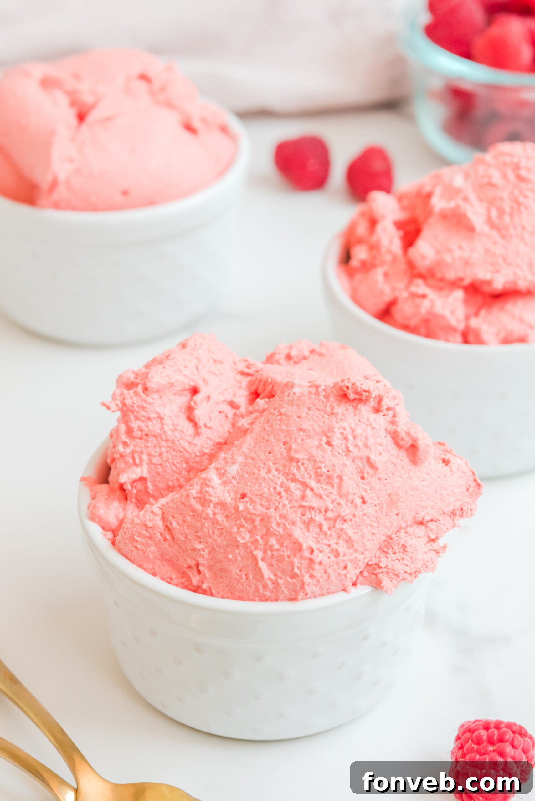 Luscious Raspberry Whip 4 Front view of Raspberry Jello Fluff in a white dish, highlighting its creamy texture.
