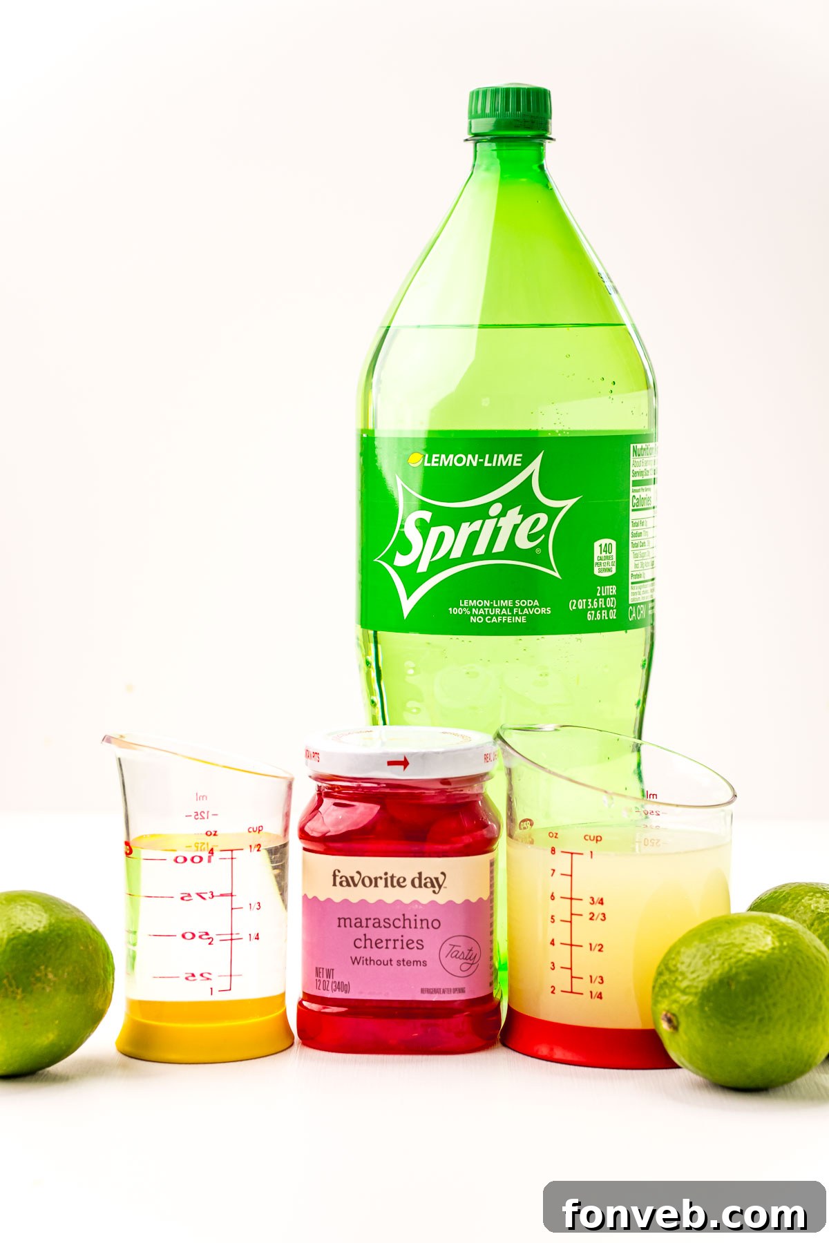 Crimson Zest Quencher 5 A flat lay of the essential ingredients for Cherry Limeade: a glass of maraschino cherries with syrup, fresh limes, simple syrup, lemon-lime soda, and a bowl of ice.