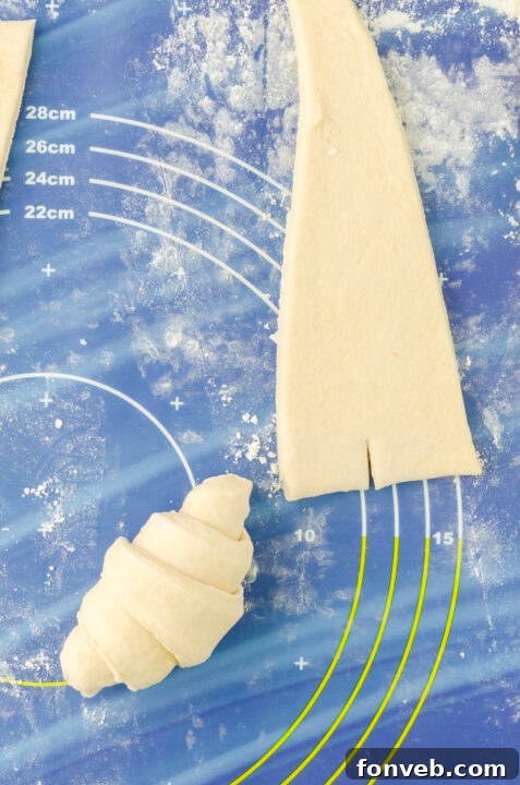 The dough being folded into thirds, demonstrating the 'book fold' technique.