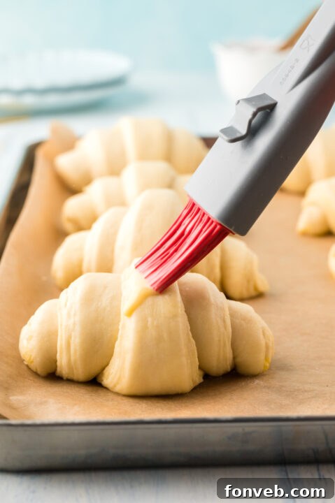 The process of cutting the laminated dough into triangles for shaping.