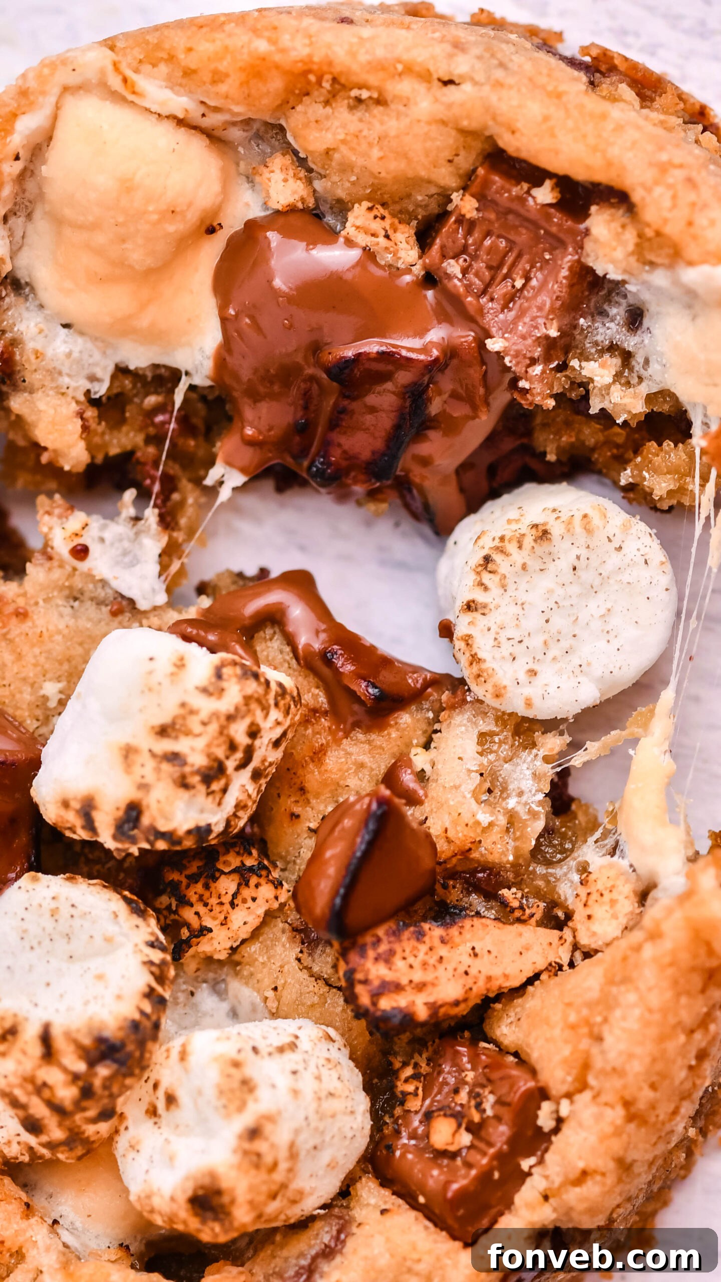 Close up view of Deep Dish S’mores Cookies split in half.