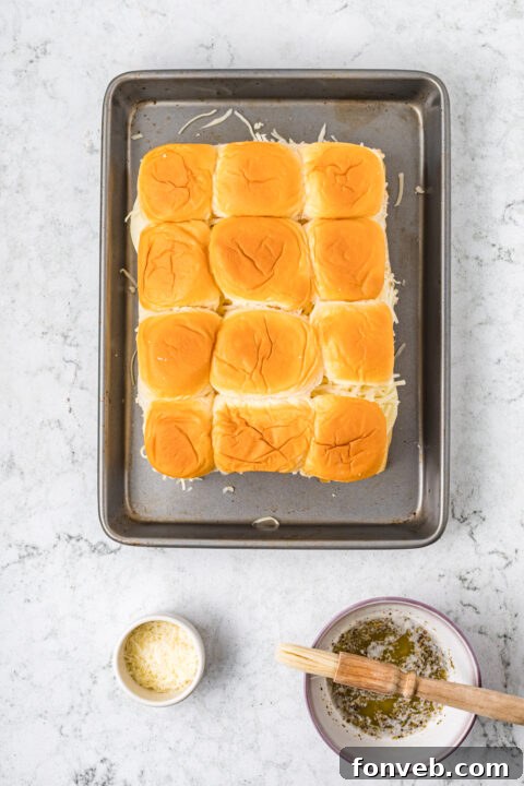 Ultimate Pizza Pull-Aparts 13 The top half of the rolls placed back onto the sliders.