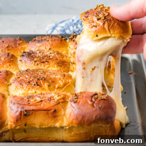 Ultimate Pizza Pull-Aparts 19 A top-down view of cooked pizza sliders in a pan.