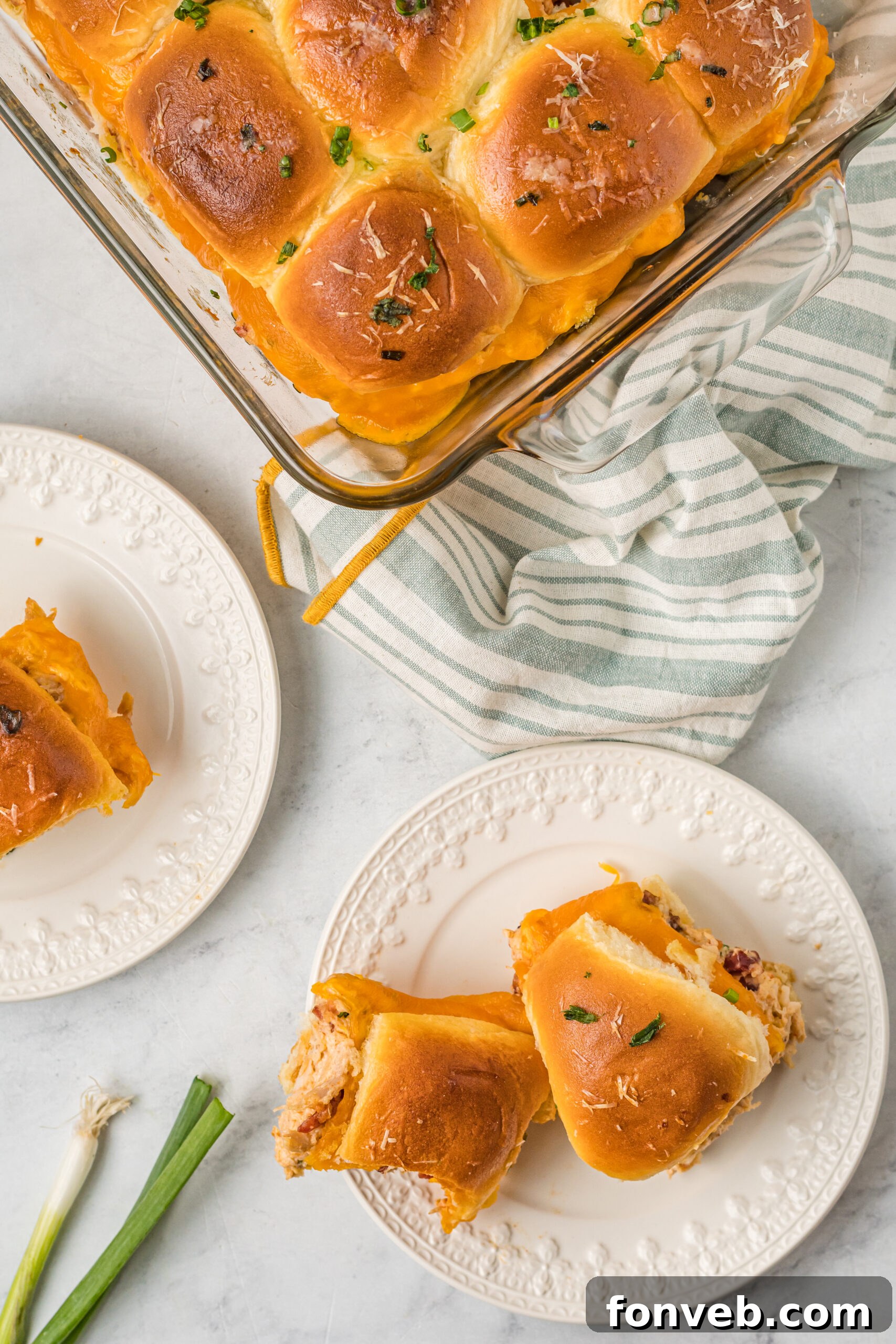 Overhead view of two Crack Chicken Sliders on a white plate.