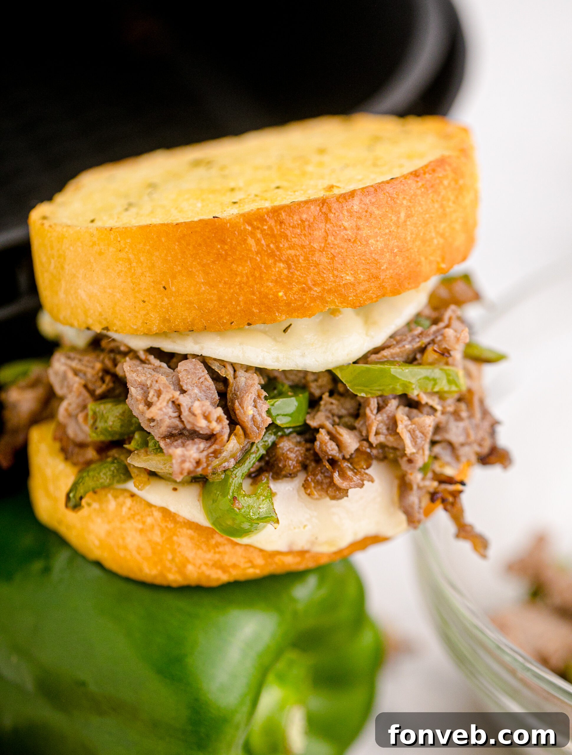 Golden Air Fryer Philly Cheesesteaks 13 Front view of an Air Fryer Philly Cheese Steak with visible green bell pepper slices.