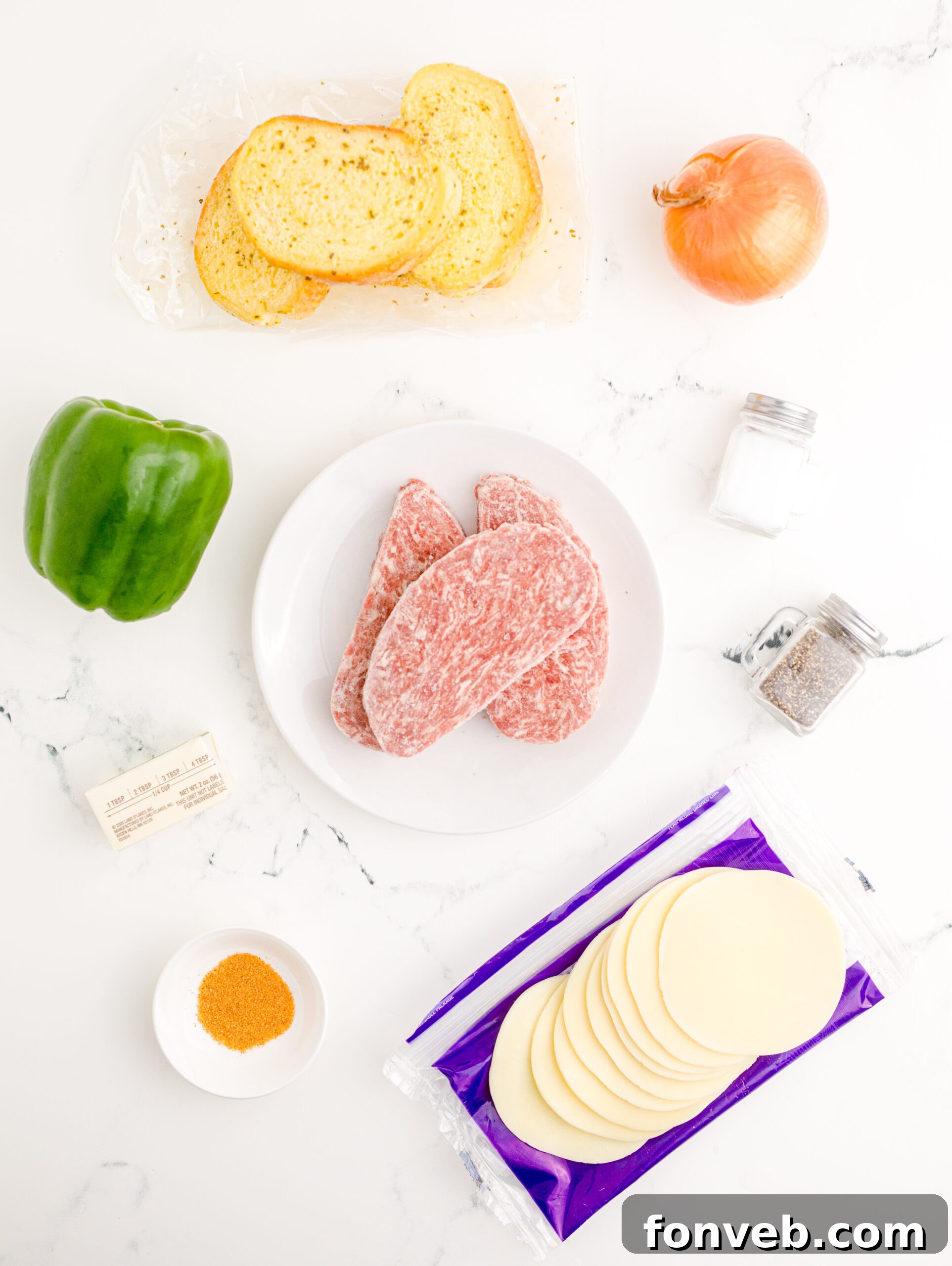 Golden Air Fryer Philly Cheesesteaks 6 Overhead view of all the fresh ingredients needed to prepare the Air Fryer Philly Cheese Steaks recipe.