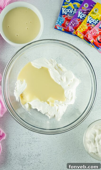Zesty Easter Kool-Aid Pie 9 Mixing pink Kool-Aid powder into a bowl of whipped cream and condensed milk mixture.