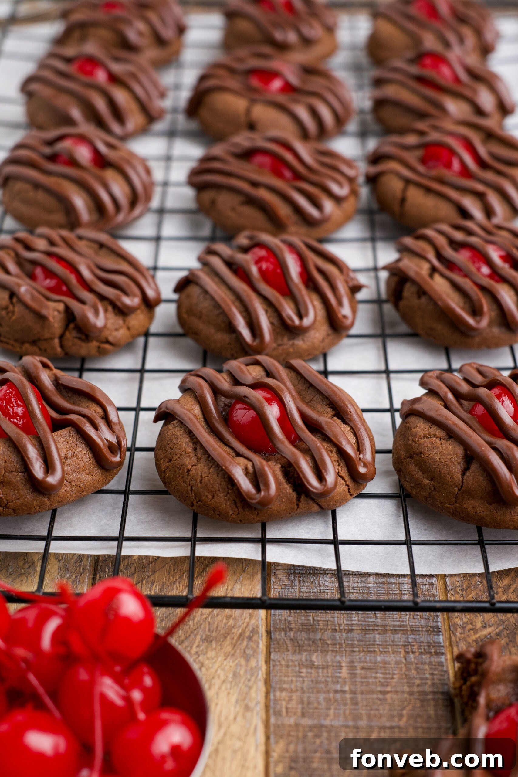 Chocolate Cherry Cookies on a cooling rack topped with a chocolate drizzle