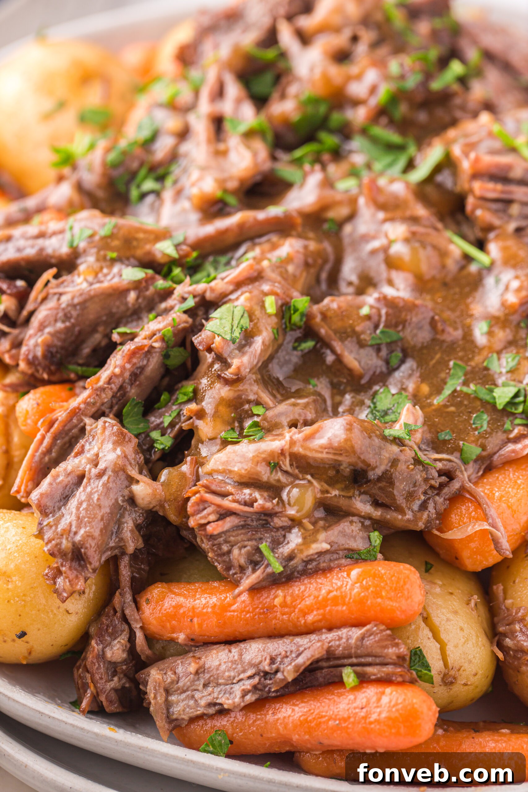 Melt-in-Your-Mouth Instant Pot Pot Roast 4 Close up of the Instant Pot Pot Roast topped with fresh parsley.