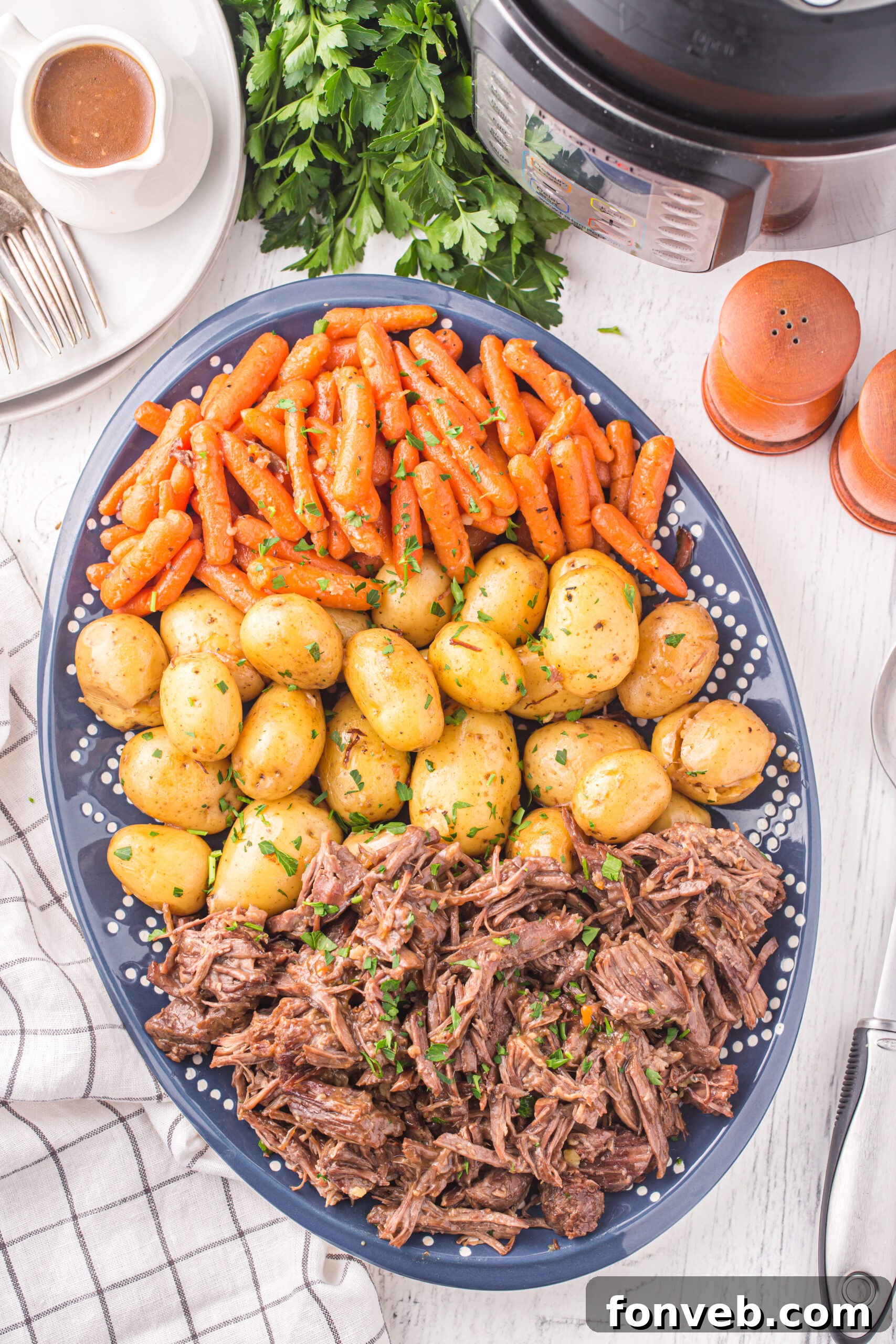 Melt-in-Your-Mouth Instant Pot Pot Roast 9 Overhead view of the finished pot roast, potatoes, and carrots.