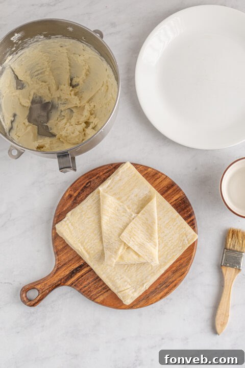 Step-by-step image of folding the side corners of the egg roll wrapper inward.