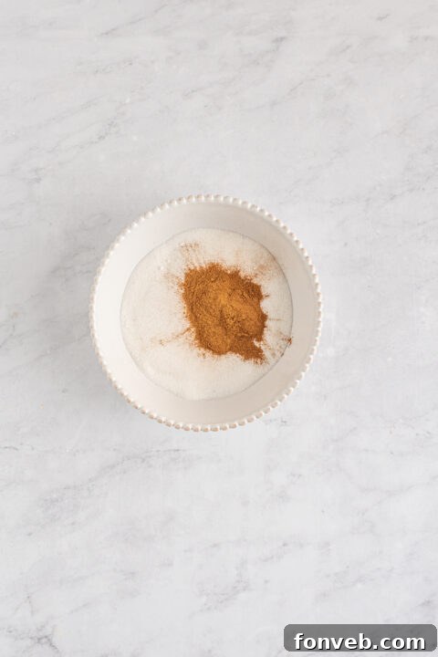 Image of a rolled egg roll ready for frying.