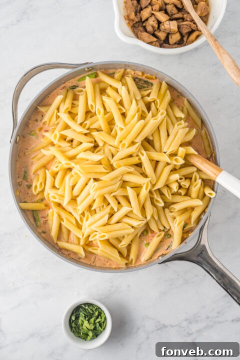 The finished Cajun Chicken Pasta, freshly tossed and ready for serving.