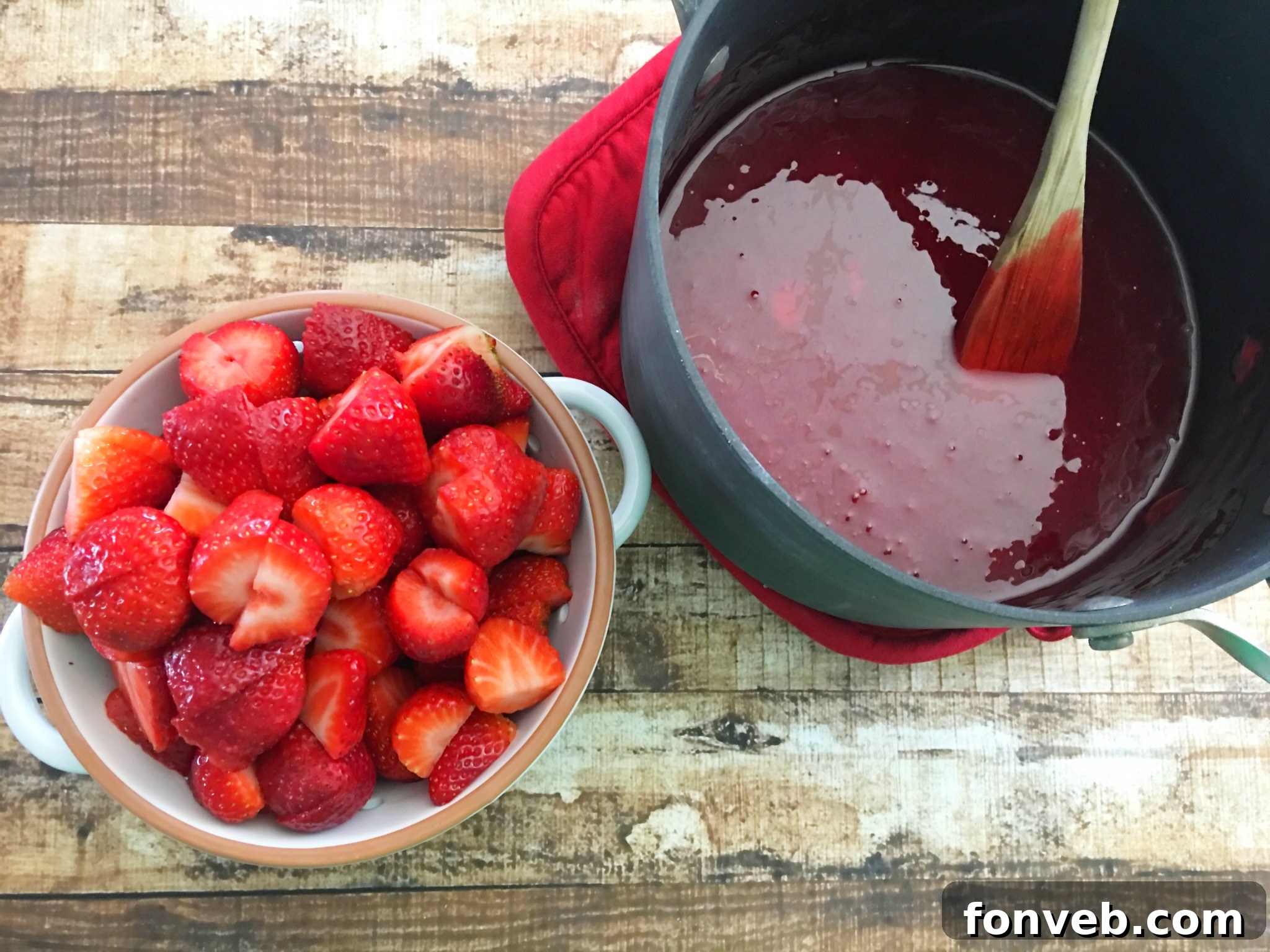 Homemade Southern Strawberry Sweet Tea in a pitcher with ice and fresh fruit slices