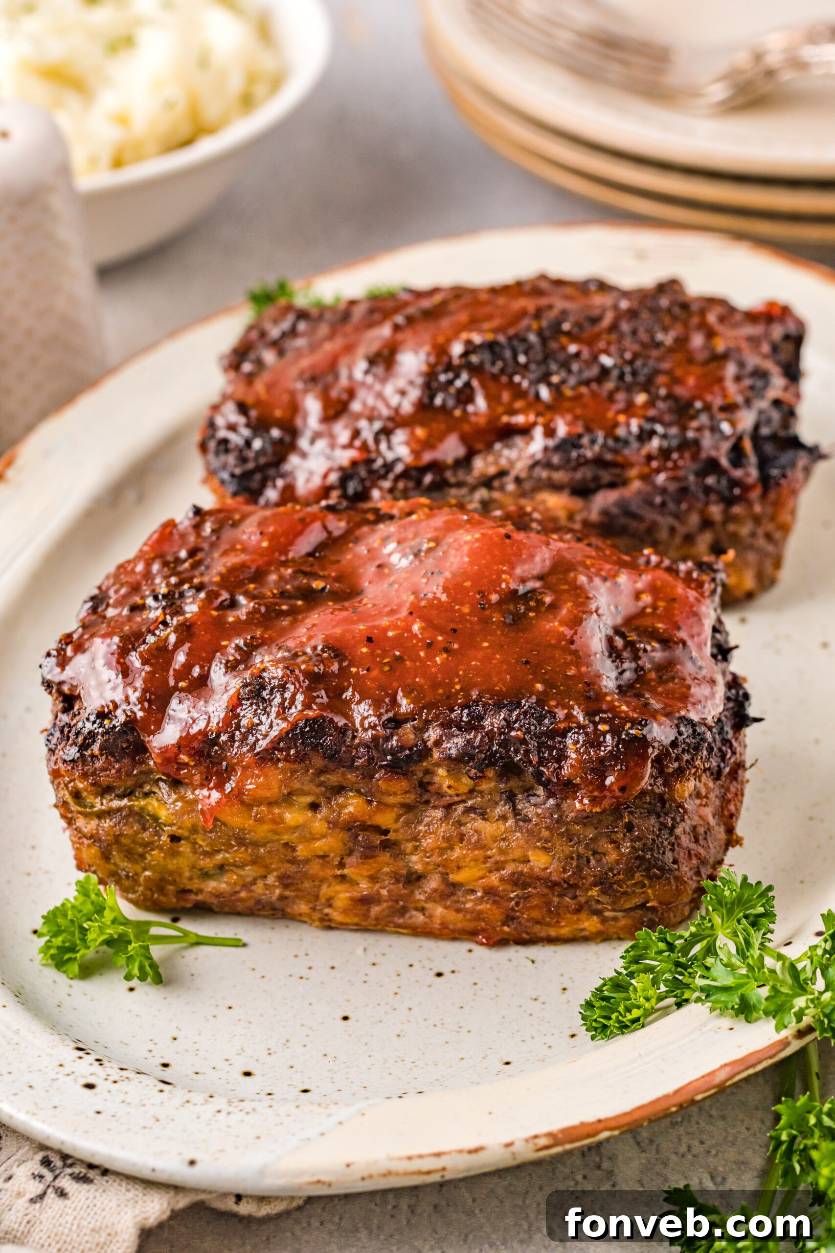 Side view of Cracker Barrel Meatloaf on a serving dish.