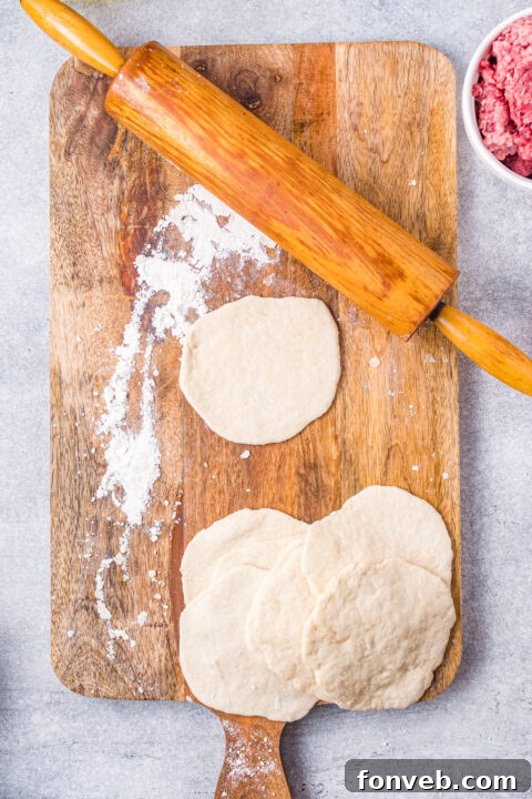 A close-up of a homemade chalupa shell, perfectly fried and golden brown.