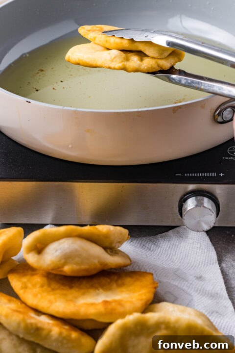 Ground beef cooking in a skillet, seasoned with taco spices.